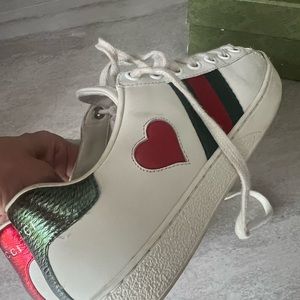Gucci Women’s Ace low heart Sneaker. Used , no stains , no tears.